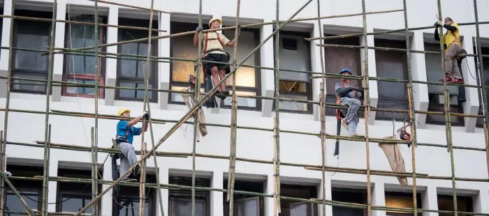 Construction workers on scaffolding