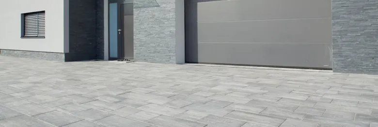 Paved driveway with house