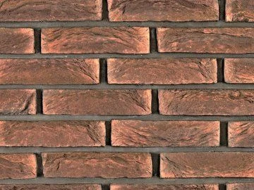 Detail červených cihlových obkladů na fasádu budovy.