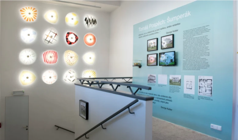 Exhibition display with floor plans and interior photos