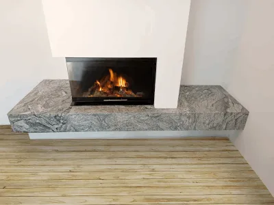 Moderní kamenný obklad za krb s bílými stěnami a dřevěnou podlahou.