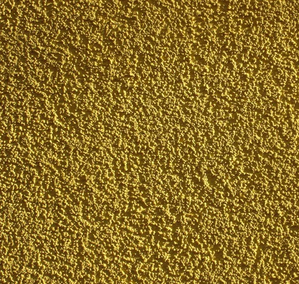 Textured yellow stucco wall