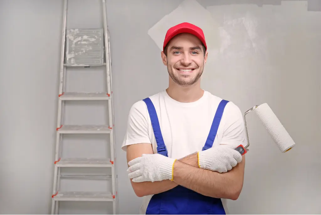 Painter with roller and ladder