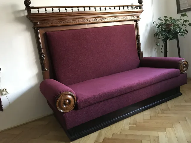 Upholstered sofa with wooden frame