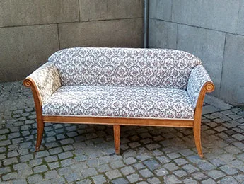 Patterned sofa with wooden frame