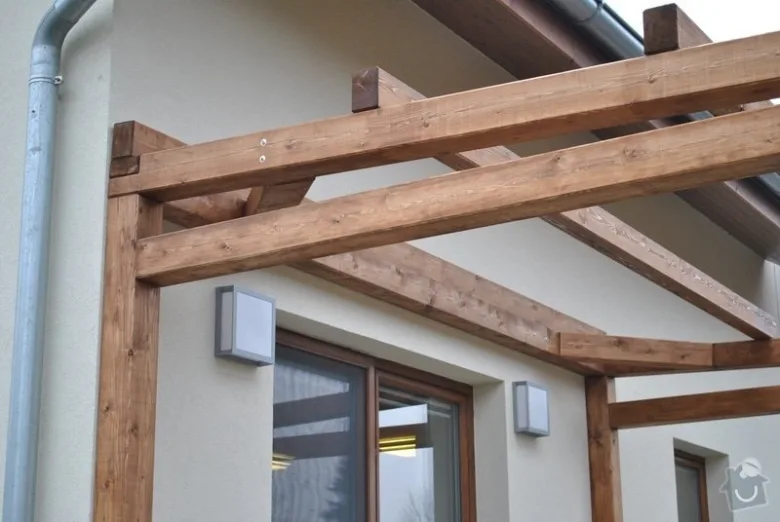 Wooden pergola structure on house wall