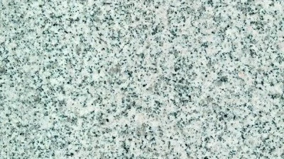 Detail textury dlažby z granitu pro interiérové schody.