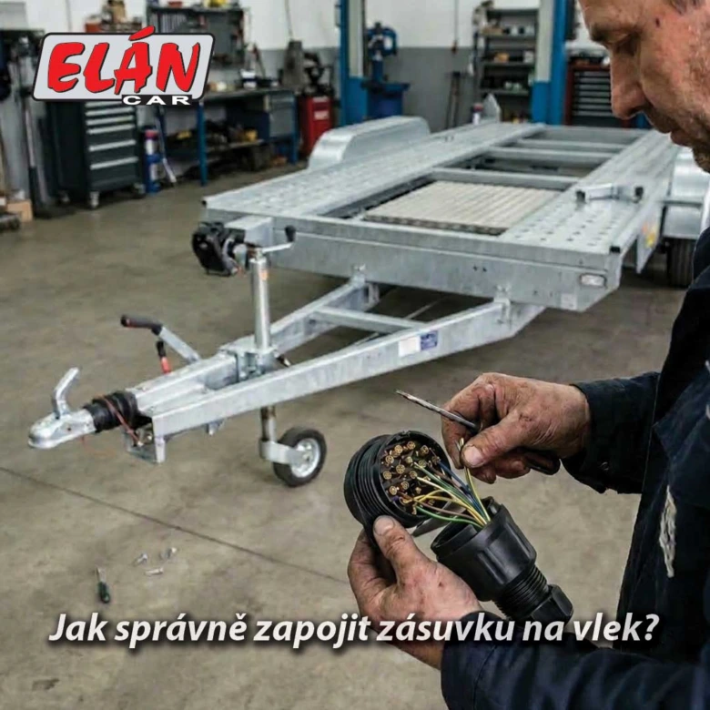 Mechanik zapojuje elektrickou zásuvku na přívěsovém vozidle v dílně.